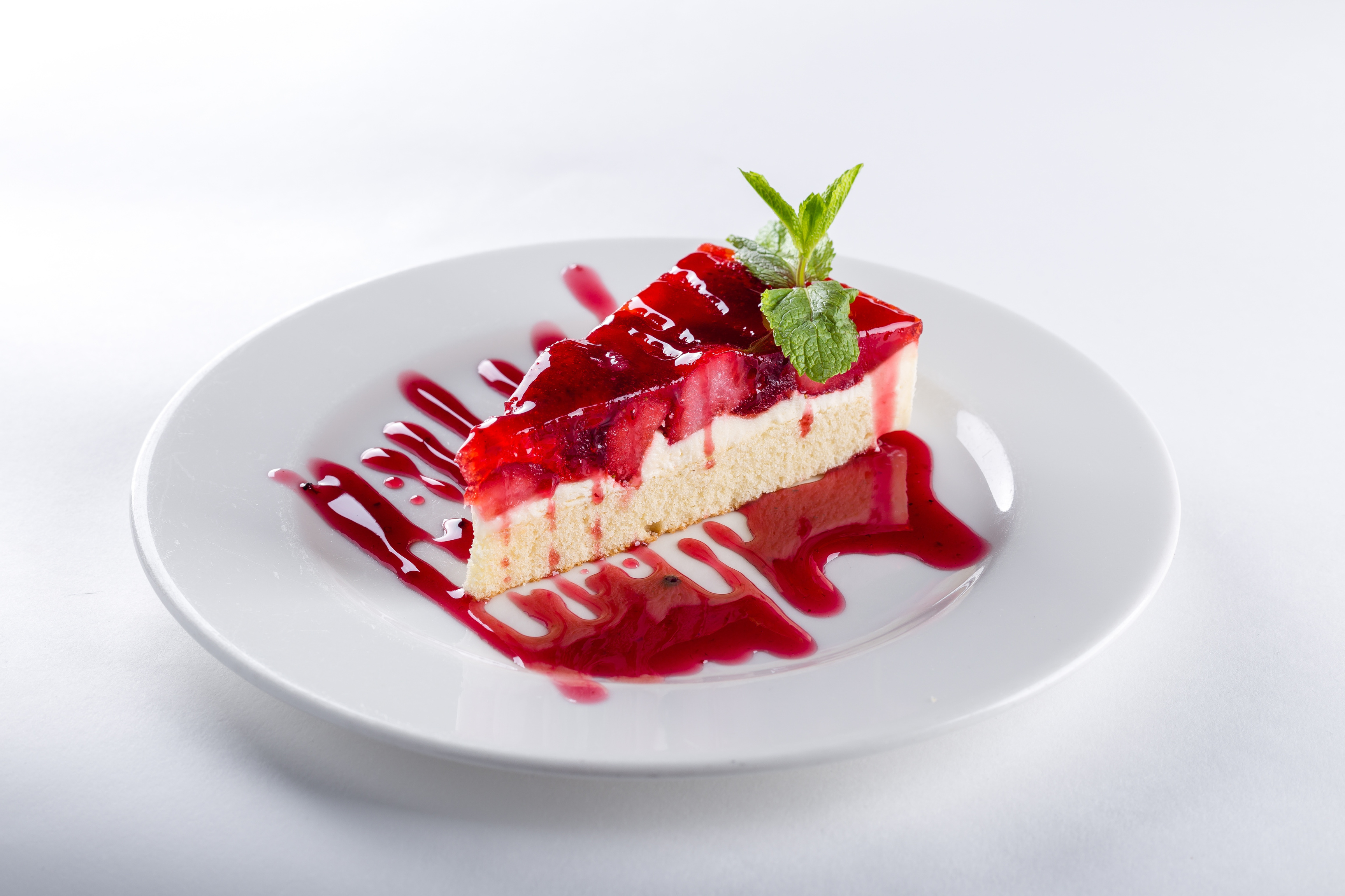 Slice of Berries Cake on White Background